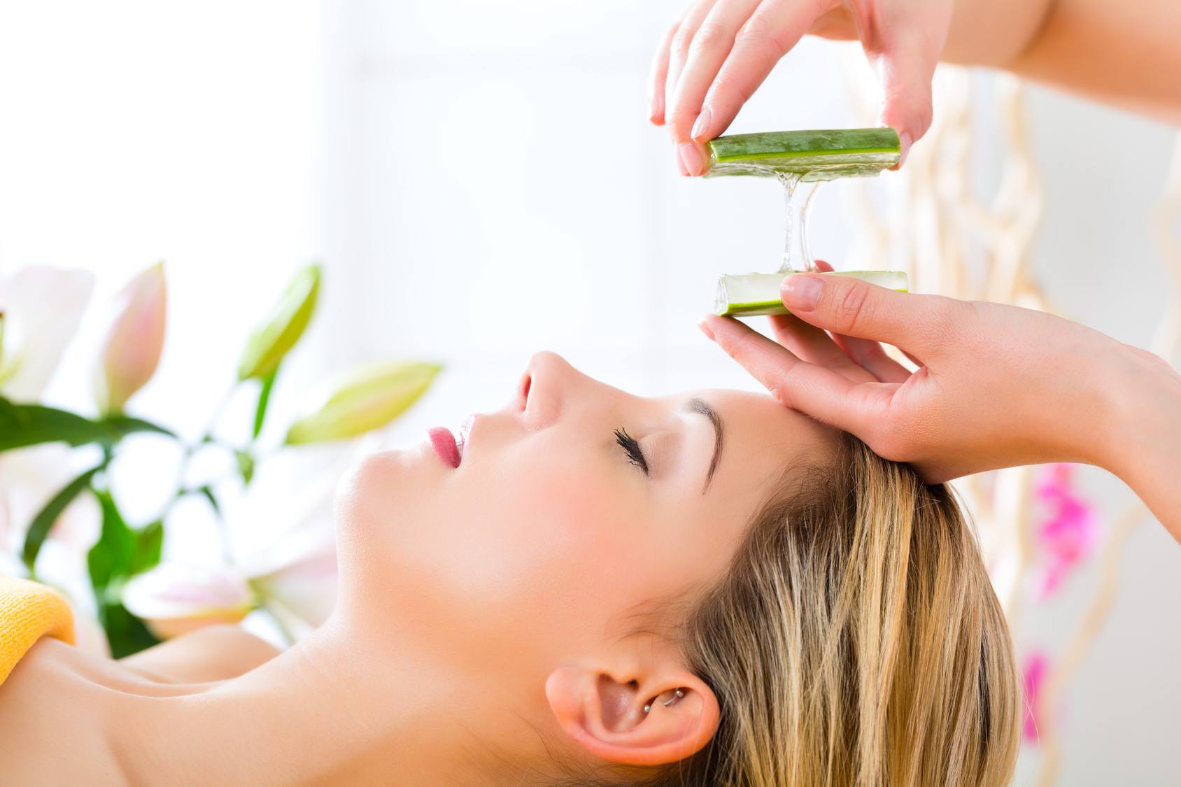 Wellness - woman having aloe vera application